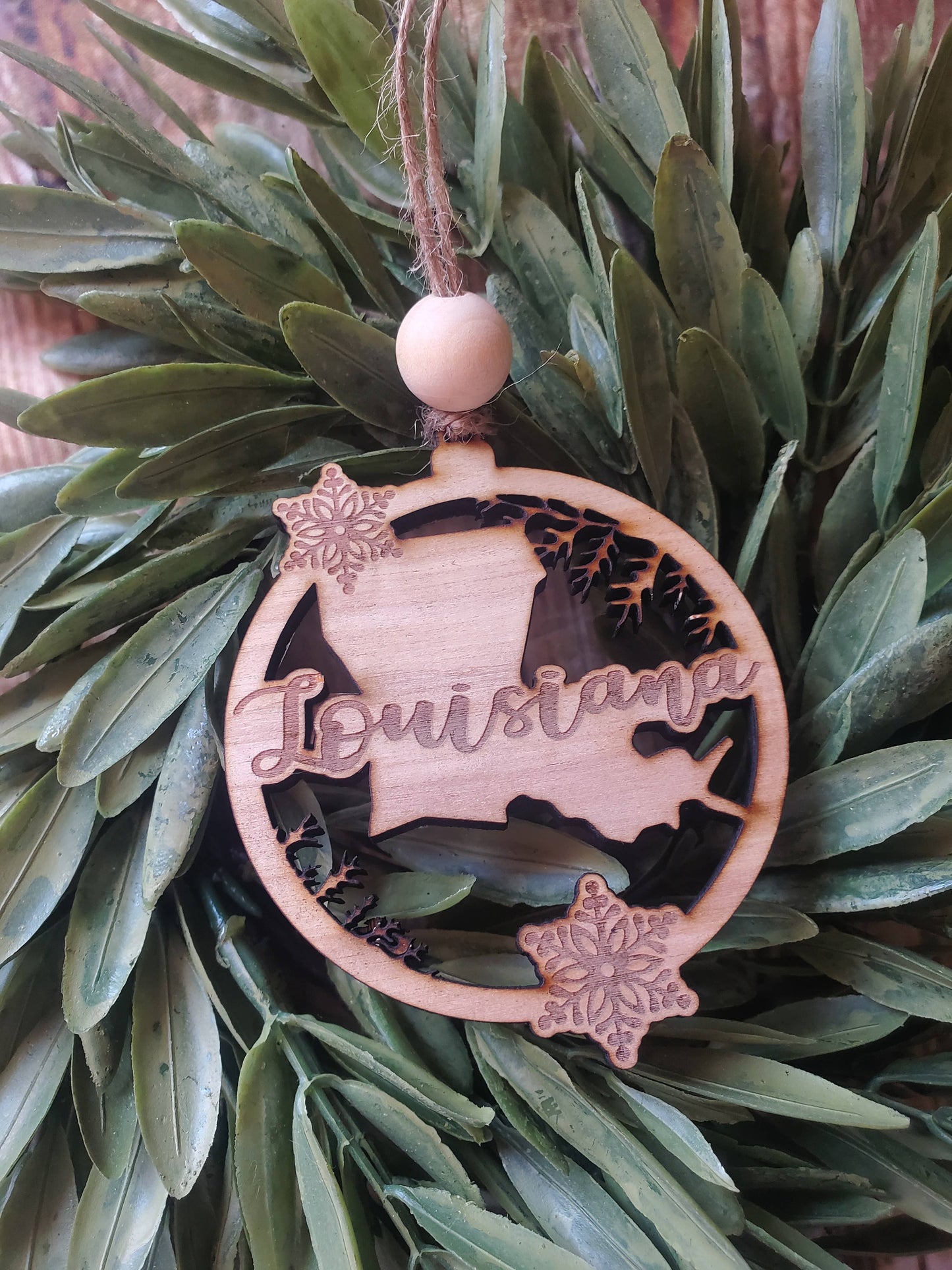 State wood ornament with snowflake