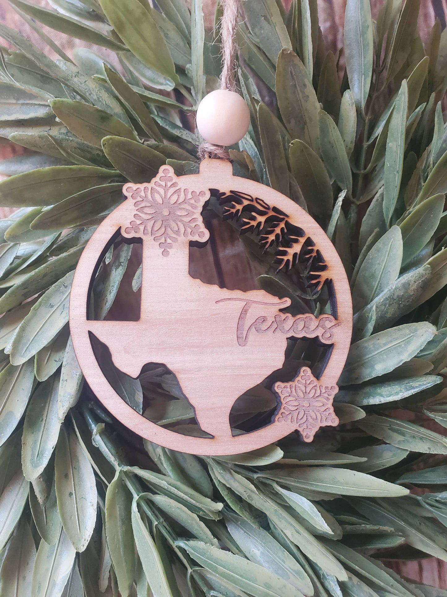 State wood ornament with snowflake